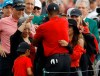 Tiger Woods hugs his family after winning the Masters golf tournament Sunday, April 14, 2019, in Augusta, Ga. (AP Photo/Matt Slocum)
