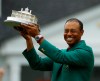 Tiger Woods wears his green jacket holding the winning trophy after the final round for the Masters golf tournament Sunday, April 14, 2019, in Augusta, Ga. (AP Photo/Matt Slocum)