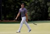 Corey Conners reacts after missing a putt on the 18th hole during the first round for the Masters golf tournament Thursday, April 11, 2019, in Augusta, Ga. (AP Photo/David J. Phillip)