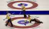 Jonathan Hayward / The Canadian Press
Manitoba skip Jennifer Jones (right) makes a shot as second Jill Officer and lead Dawn Askin look on during a draw against P.E.I. at the Scotties Tournament of Hearts in Red Deer, Alta., on Sunday.