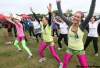 Joe Bryksa / Winnipeg Free Press
Luke Chapman, Sarah Oswald (centre) and Karen Oswald participate in a warm-up session before the Terry Fox Run Sunday morning at Assiniboine Park.