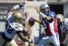 Graham Hughes / The Canadian Press
Montreal Alouettes quarterback Anthony Calvillo (13) is under pressure from the Blue Bombers' Bryant Turner (92) during first-half CFL football action in Montreal on Sunday. The Bombers won 25-23.