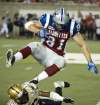Paul Chiasson / The Canadian Press
Montreal Alouettes fullback Patrick Lavoie leaps to avoid Winnipeg Blue Bombers cornerback Demond Washington during fourth quarter CFL football action on Friday in Montreal.