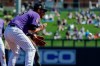 Colorado Rockies third baseman Nolan Arenado fields a ball hit by Milwaukee Brewers' Tyler Saladino during the second inning of a spring baseball game in Scottsdale, Ariz., Tuesday, March 5, 2019. Saladino grounded into a force-out. (AP Photo/Chris Carlson)