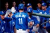 Kansas City Royals' Bubba Starling (11) celebrates with teammates after hitting a solo home run during the third inning of a spring training baseball game against the Colorado Rockies, Monday, Feb. 25, 2019, in Surprise, Ariz. (AP Photo/Charlie Riedel)
