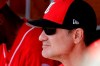 Cincinnati Reds' manager David Bell watches from the dugout during the first inning of a spring training baseball game against the Milwaukee Brewers, Sunday, March 3, 2019, in Phoenix. (AP Photo/Charlie Riedel)