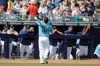 Seattle Mariners' Yusei Kikuchi tosses a baseball to fans during the first inning of a spring training baseball game against the Cincinnati Reds, Monday, Feb. 25, 2019, in Peoria, Ariz. (AP Photo/Darron Cummings)