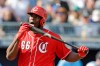 Cincinnati Reds' Yasiel Puig licks his bat during the third inning of a spring training baseball game against the Seattle Mariners, Monday, Feb. 25, 2019, in Peoria, Ariz. (AP Photo/Darron Cummings)