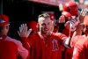 Los Angeles Angels' Mike Trout is congratulated by teammates on his three-run home run against the Chicago White Sox in the first inning of a spring training baseball game Friday, March 22, 2019, in Tempe, Ariz. (AP Photo/Elaine Thompson)