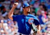 Chicago Cubs starting pitcher Yu Darvish throws in the first inning of a spring training baseball game against the Seattle Mariners, Tuesday, March 19, 2019, in Mesa, Ariz. (AP Photo/Elaine Thompson)