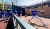 Teammates and coaches watch as Chicago Cubs starting pitcher Kyle Hendricks warms up in the bullpen before the team's spring training baseball game against the Arizona Diamondbacks on Saturday, March 16, 2019, in Scottsdale, Ariz. (AP Photo/Elaine Thompson)