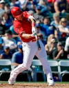 Los Angeles Angels' Mike Trout connects on a three-run home run against the Chicago Cubs in the third inning of a spring training baseball game Tuesday, March 5, 2019, in Tempe, Ariz. (AP Photo/Elaine Thompson)