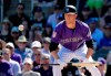 Colorado Rockies' Kyle Freeland watches his bunt head toward the infield in the fourth inning of a spring training baseball game against the Cincinnati Reds, Monday, March 18, 2019, in Scottsdale, Ariz. Freeland was out on the sacrifice, sending Rockies' Chris Iannetta to third base on the play. (AP Photo/Elaine Thompson)
