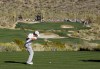 Northern Ireland's Rory McIlroy tees off on the 15th hole while facing Miguel Angel Jimenez during the Match Play Championship golf tournament, Friday, Feb. 24, 2012, in Marana, Ariz. (AP Photo/Eric Risberg)