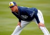 San Diego Padres' Manny Machado warms up prior to his first spring training baseball game of the season against the San Francisco Giants, Saturday, March 2, 2019, in Peoria, Ariz. (AP Photo/Matt York)