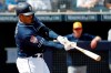 San Diego Padres' Manny Machado hits a two-run home run against the Milwaukee Brewers during the first inning of a spring training baseball game, Wednesday, March 20, 2019, in Peoria, Ariz. (AP Photo/Matt York)