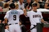 Arizona Diamondbacks' Josh Rojas (9) high-fives manager Torey Lovullo after scoring on a base hit by Jake Lamb during the first inning of a baseball game against the San Diego Padres on Tuesday, Sept. 3, 2019, in Phoenix. (AP Photo/Matt York)