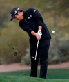 Byeong Hun An hits from the second fairway during the final round of the Phoenix Open PGA golf tournament, Sunday, Feb. 3, 2019, in Scottsdale, Ariz. (AP Photo/Matt York)