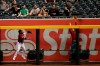 A fan tries to get a glove on a solo home run hit by Miami Marlins' Austin Dean during the fourth inning of a baseball game as Arizona Diamondbacks' Abraham Almonte looks on Wednesday, Sept. 18, 2019, in Phoenix. (AP Photo/Matt York)