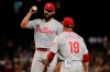 Philadelphia Phillies manager Gabe Kapler (19) talks with starting pitcher Jake Arrieta during the fifth inning of the team's baseball game against the Arizona Diamondbacks, Tuesday, Aug. 6, 2019, in Phoenix. (AP Photo/Matt York)