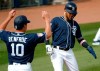 San Diego Padres' Fernando Tatis Jr. and Hunter Renfroe (10) score on a double by teammate Ian Kindler during the second inning of a spring training baseball game against the San Francisco Giants, Saturday, March 2, 2019, in Peoria, Ariz. (AP Photo/Matt York)