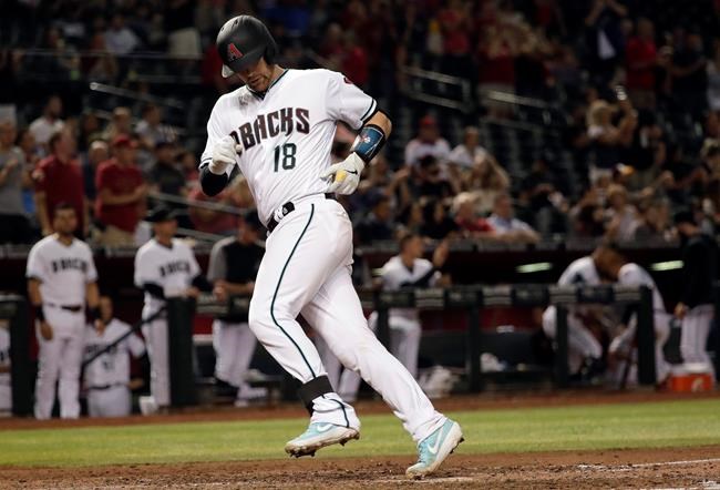 Arizona Diamondbacks' Carson Kelly crosses home plate after hitting a solo home run against the Pittsburgh Pirates during the eighth inning of a baseball game Tuesday, May 14, 2019, in Phoenix. (AP Photo/Matt York)