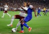 Mexico defender Luis Rodriguez, left, applies pressure on Haiti forward Herve Bazile, right, during the first half of a CONCACAF Gold Cup soccer match Tuesday, July 2, 2019, in Glendale, Ariz. (AP Photo/Ross D. Franklin)