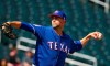 Texas Rangers pitcher Mike Minor throws against the Cleveland Indians during the second inning of a spring training baseball game Monday, Feb. 25, 2019, in Goodyear, Ariz. (AP Photo/Ross D. Franklin)