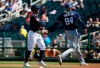 San Diego Padres' Fernando Tatis Jr. (84) tags out Cleveland Indians' Leonys Martin, left, in a rundown during the third inning of a spring training baseball game Monday, March 18, 2019, in Goodyear, Ariz. (AP Photo/Ross D. Franklin)