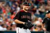 Arizona Diamondbacks starting pitcher Robbie Ray winces in pain after getting hit by a line drive off the bat of San Diego Padres' Manuel Margot during the fourth inning of a baseball game, Saturday, Sept. 28, 2019, in Phoenix. (AP Photo/Ralph Freso)