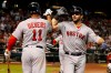Boston Red Sox's Mitch Moreland celebrates with Rafael Devers (11) after hitting a solo home run against the Arizona Diamondbacks in the seventh inning of a baseball game, Sunday, April 7, 2019, in Phoenix. (AP Photo/Rick Scuteri)