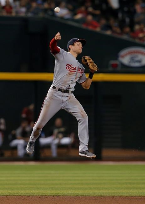 Washington Nationals shortstop Trea Turner makes a off-balance throw for an out on a ball hit by Arizona Diamondbacks' Nick Ahmed in the fourth inning during a baseball game, Sunday, Aug. 4, 2019, in Phoenix. (AP Photo/Rick Scuteri)