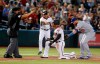 Arizona Diamondbacks' Eduardo Escobar reacts in front of Los Angeles Dodgers third baseman Justin Turner (10) after hitting a triple during the 11th inning during a baseball game Wednesday, June 5, 2019, in Phoenix. The Diamondbacks defeated the Dodgers 3-2. (AP Photo/Rick Scuteri)