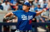 Los Angeles Dodgers pitcher Hyun-Jin Ryu delivers in the first inning of a spring training baseball game against the Milwaukee Brewers Thursday, March 21, 2019, in Phoenix. (AP Photo/Sue Ogrocki)