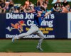 Chicago Cubs' second baseman Ian Happ reaches for a fly ball hit by Milwaukee Brewers' Cory Spangenberg for an out in the fifth inning of a spring training baseball game Sunday, March 10, 2019, in Phoenix. (AP Photo/Sue Ogrocki)