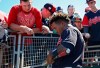 Cleveland Indians' Jose Ramirez signs a bat for a fan before a spring training baseball game against the Colorado Rockies, Thursday, March 14, 2019, in Goodyear, Ariz. (AP Photo/Sue Ogrocki)