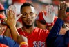Boston Red Sox's Xander Bogaerts gets high-fives in the dugout after scoring during the seventh inning of the team's spring training baseball game against the Chicago Cubs on Monday, March 25, 2019, in Mesa, Ariz. (AP Photo/Sue Ogrocki)