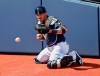 Milwaukee Brewers catcher Yasmani Grandal warms up before a spring training baseball game against the Arizona Diamondbacks, Friday, March 8, 2019, in Phoenix. (AP Photo/Sue Ogrocki)