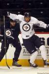 KEN GIGLIOTTI / WINNIPEG FREE PRESS
Jets captain Andrew Ladd gets past No. 6, Ron Hainsey, during practice as Ladd prepares for his return to Chicago.