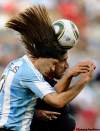 Martin Meissner / The Associated Press
Argentina's Martin Demichelis, left, competes for the ball with Germany's Sami Khedira.