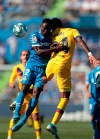 Getafe's Djene Dakonam, left, and Barcelona's Junior Firpo jump for the ball during the Spanish La Liga soccer match between Getafe CF and FC Barcelona in Getafe, outskirts of Madrid, Spain, Saturday, Sept. 28, 2019. (AP Photo/Bernat Armangue)