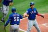 Texas Rangers' Shin-Soo Choo, right, of South Korea, celebrates with Jose Trevino (56) after they scored on a single by Nick Solak during the second inning of a baseball game against the Baltimore Orioles, Sunday, Sept. 8, 2019, in Baltimore. (AP Photo/Nick Wass)