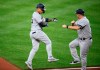 New York Yankees' Gleyber Torres, left, celebrates his home run with third base coach Phil Nevin during the third inning of the team's baseball game against the Baltimore Orioles, Wednesday, May 22, 2019, in Baltimore. (AP Photo/Nick Wass)