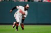Baltimore Orioles left fielder Dwight Smith Jr. fields a single by Toronto Blue Jays' Bo Bichette during the second inning of a baseball game, Wednesday, Sept. 18, 2019, in Baltimore. Blue Jays' Rowdy Tellez scored on the play. (AP Photo/Julio Cortez)