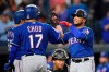 Texas Rangers' Willie Calhoun, right, celebrates his three-run home run with Shin-Soo Choo (17) and Jose Trevino, left, during the third inning of a baseball game against the Baltimore Orioles, Friday, Sept. 6, 2019, in Baltimore. Orioles catcher Pedro Severino, bottom center, looks on. (AP Photo/Nick Wass)