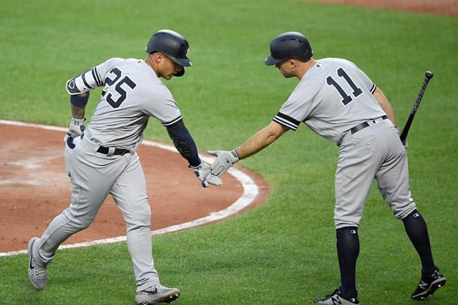 New York Yankees' Gleyber Torres (25) celebrates his home run with Brett Gardner (11) during the third inning of the team's baseball game against the Baltimore Orioles, Wednesday, May 22, 2019, in Baltimore. (AP Photo/Nick Wass)