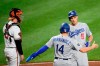 Los Angeles Dodgers' Corey Seager (5) celebrates his two-run home run with Enrique Hernandez (14) during the third inning of a baseball game, next to Baltimore Orioles catcher Chance Sisco on Tuesday, Sept. 10, 2019, in Baltimore. (AP Photo/Nick Wass)