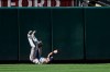 Tampa Bay Rays center fielder Kevin Kiermaier tumbles on the ground after he made an attempt on a ball that went for a two-run home run by Baltimore Orioles' Stevie Wilkerson during the seventh inning of the first baseball game of a split doubleheader, Saturday, July 13, 2019, in Baltimore. The Orioles won 2-1. (AP Photo/Nick Wass)