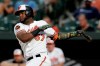 Baltimore Orioles' Hanser Alberto follows through on a swing during the second inning of the team's baseball game against the Kansas City Royals on Tuesday, Aug. 20, 2019, in Baltimore. (AP Photo/Julio Cortez)