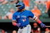 Toronto Blue Jays' Vladimir Guerrero Jr. watches his RBI single off Baltimore Orioles starting pitcher Aaron Brooks during the first inning of a baseball game Friday, Aug. 2, 2019, in Baltimore. (AP Photo/Julio Cortez)